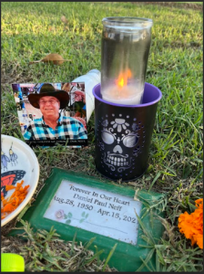 Temporary grave marker with candle and photo