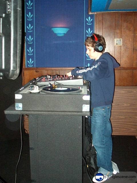 A person DJing in a nightclub