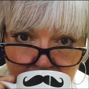 Woman in glasses and a moustache cup