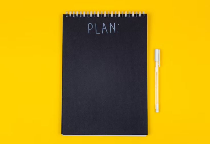 Notebook labeled PLAN