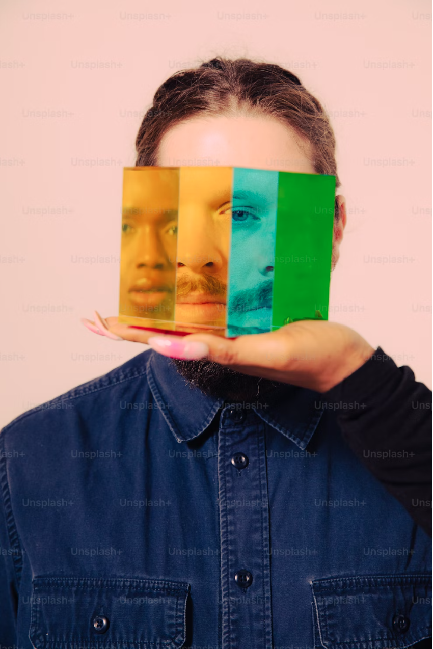 View of self in background and a hand holding faces of others.