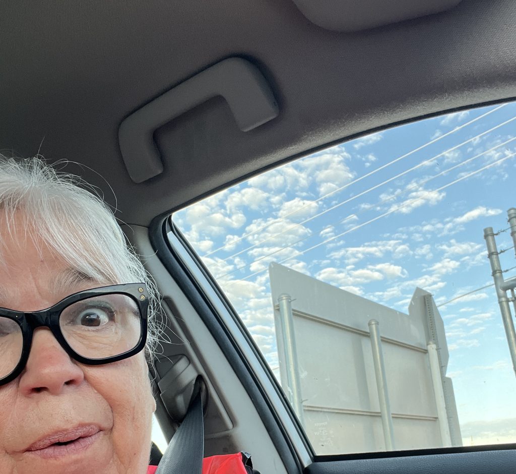 Surprised older woman at the dump for the first time.