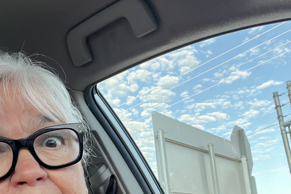 Surprised older woman at the dump for the first time.
