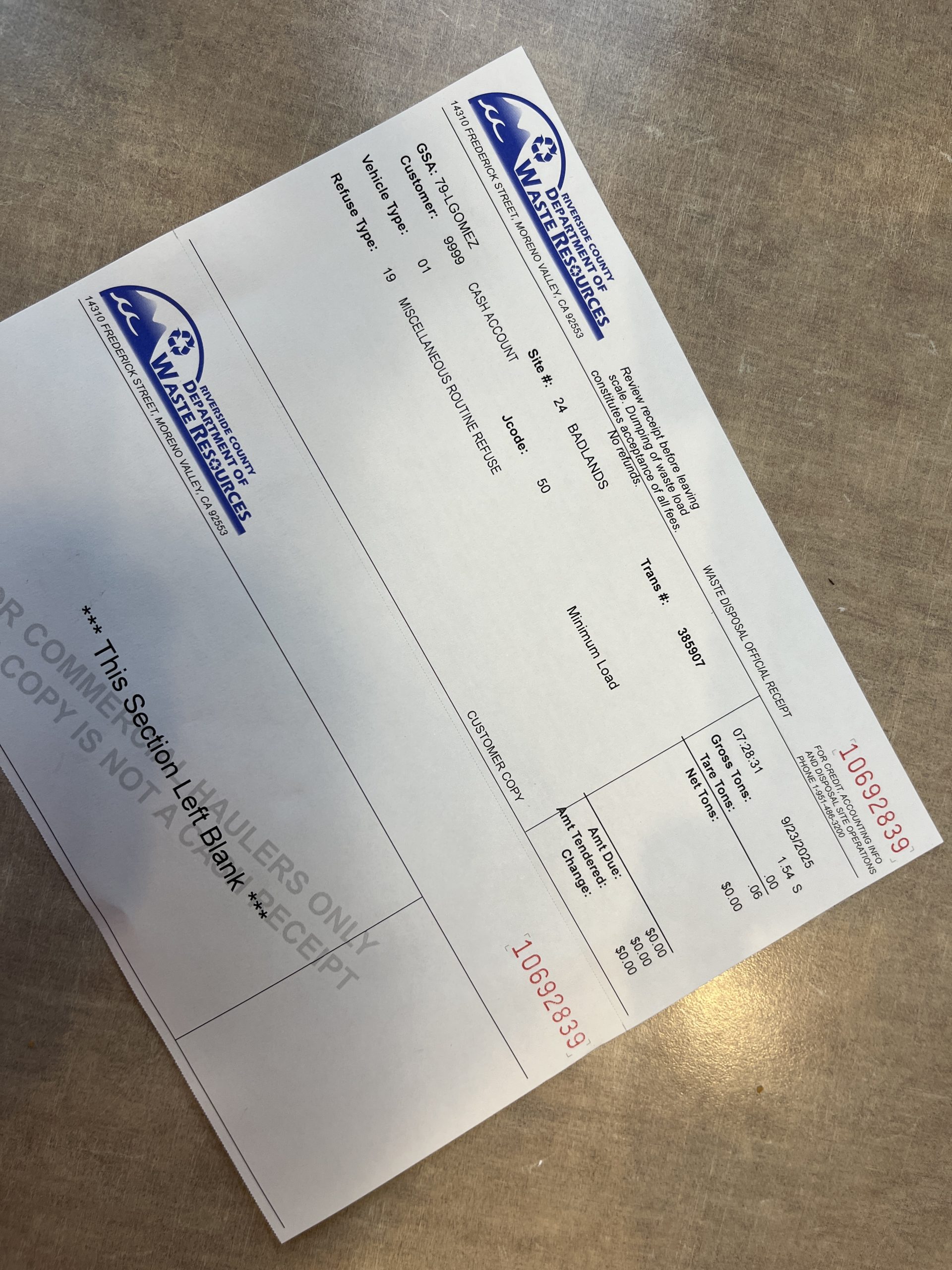 Receipt for two free bags of trash for the dump.
