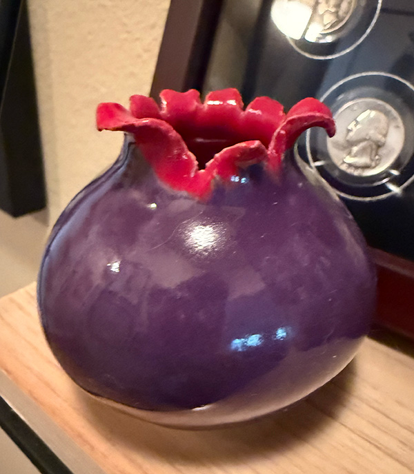 artistic purple vase with red accent