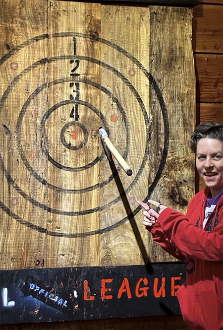 axe throwing at a wooden target